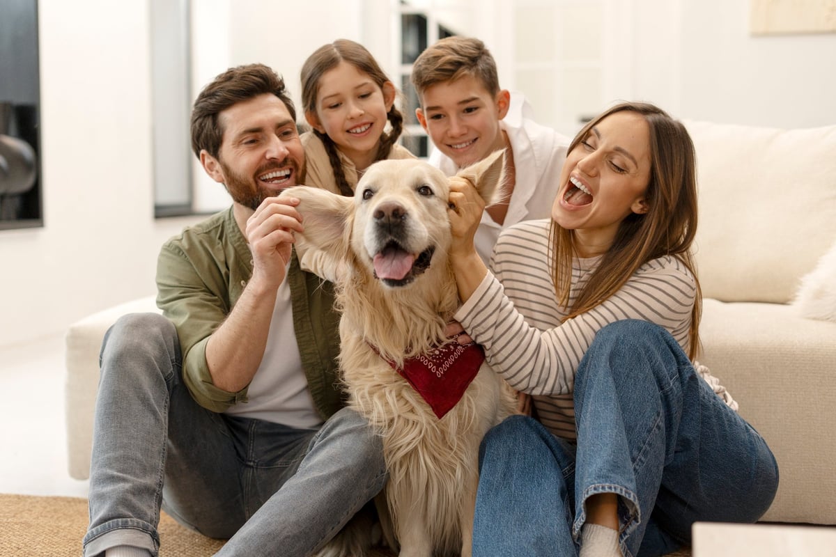 Family with their pet dog — pet trusts ensure your animals are cared for